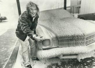 Cars parked along lakeshore area in west end were caked with up to 3 inches of frozen spray whipped up by hurricane-force winds yesterday. Ray Russell(...)