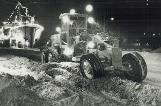 A grader snowplow at the foot of Yonge St