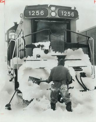 Another victim of the deep-freeze weather, this CN locomotive was as helpless as snowbound car when it ran into a snowdrift that paralyzed a switch on(...)