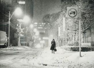 Streets were deserted and slushy snow made walking difficult near Church and Wood Sts