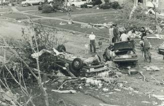 Sandy Beale looks at devastation on road in Barrie