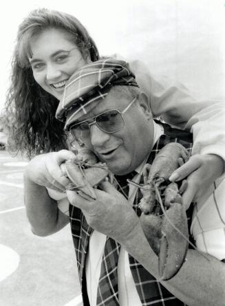 East coast fun: Corrinne Johnston, Miss Atlantic Canada, Cy Hammond, a teller of tall tales, and their crustacean friends take part in a Summerfest '90 yesterday