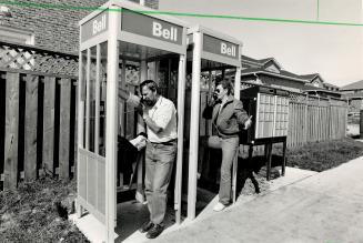 That long-distance feeling, If having to go to a supermailbox for their letters isn't enough, Steen Jacobson, left, and Doug Chivers must trude to pho(...)