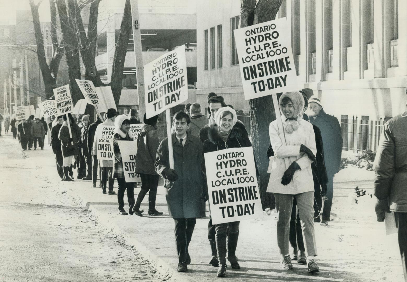 In hit-and-run strike by Ontario Hydro workers, pickets march today in front of the hydro engineering building on Murray St. Union is calling out grou(...)