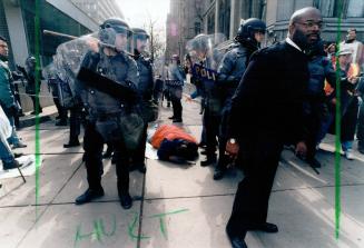 Parole officer Steve Giles lies unconscious after being clubbed by opp riot police during opseu demonstration at Queen's Park