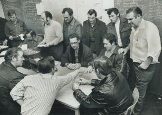 There's time for cards at rodmen's union hall at Bloor and Dundas as their strike drags on past its 10th week