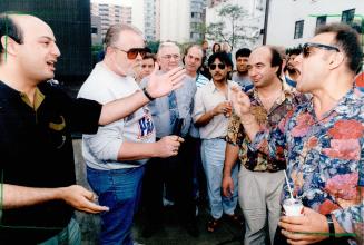 Non-Strikers, right, argue with striking Cabbie, left, and union official (in beard