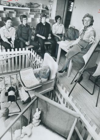 Nursery Toys are pushed aside in a room at Eglinton United Church so Shirley Brunke a real estate broker, can talk economics with students of North To(...)