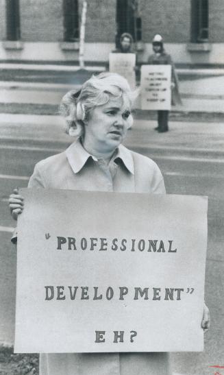 Picketing the teacher pickets, Shirley Breen carries her placard yesterday outside Georges Vanier Secondary School