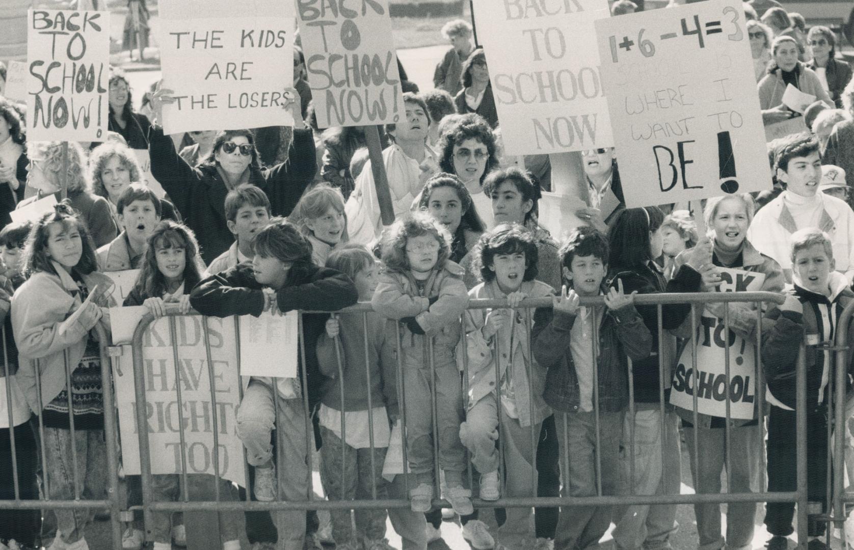 Shouting and placard-waving parents and pupils were held back momentarily by barricades at the Legislature today before breaking through into hallways(...)