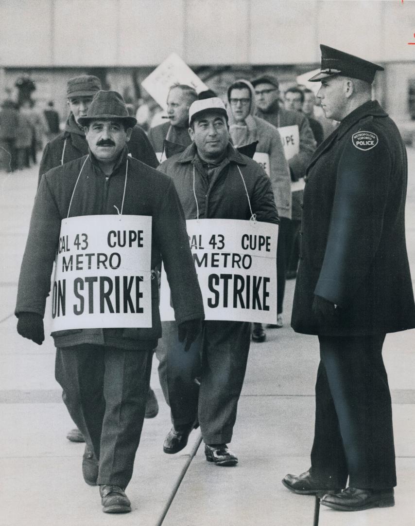 Metro strikers parading outside city hall today, If people want to walk through our picket line that's their business