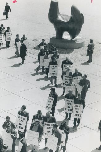 Striking civic workers parade past The Archer in Nathan Phillips Square in picketing City hall today, the 17th day of their strike. The 200 pickets in(...)