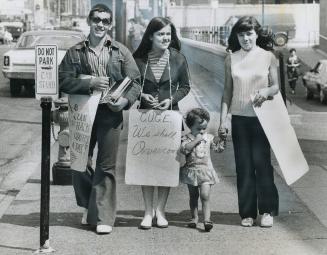 Young picket outside Toronto Western Hospital is Ida Babtista, 2, seen with sister Elizabeth Babtista, right