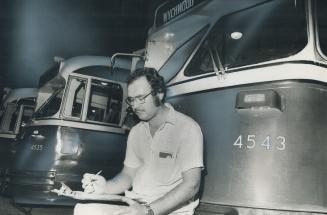 Assistant supervisor Norman McLeod prepares transfers for drivers at TTC yard on Wychwood Ave