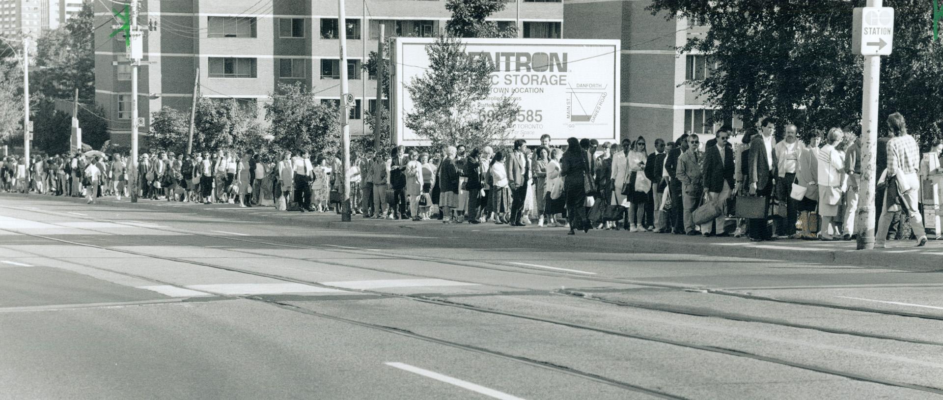 Slow Going: More than 2,000 anxious commuters line up at the Danforth Go station yesterday, hoping to get to work that way as the TTC strike began