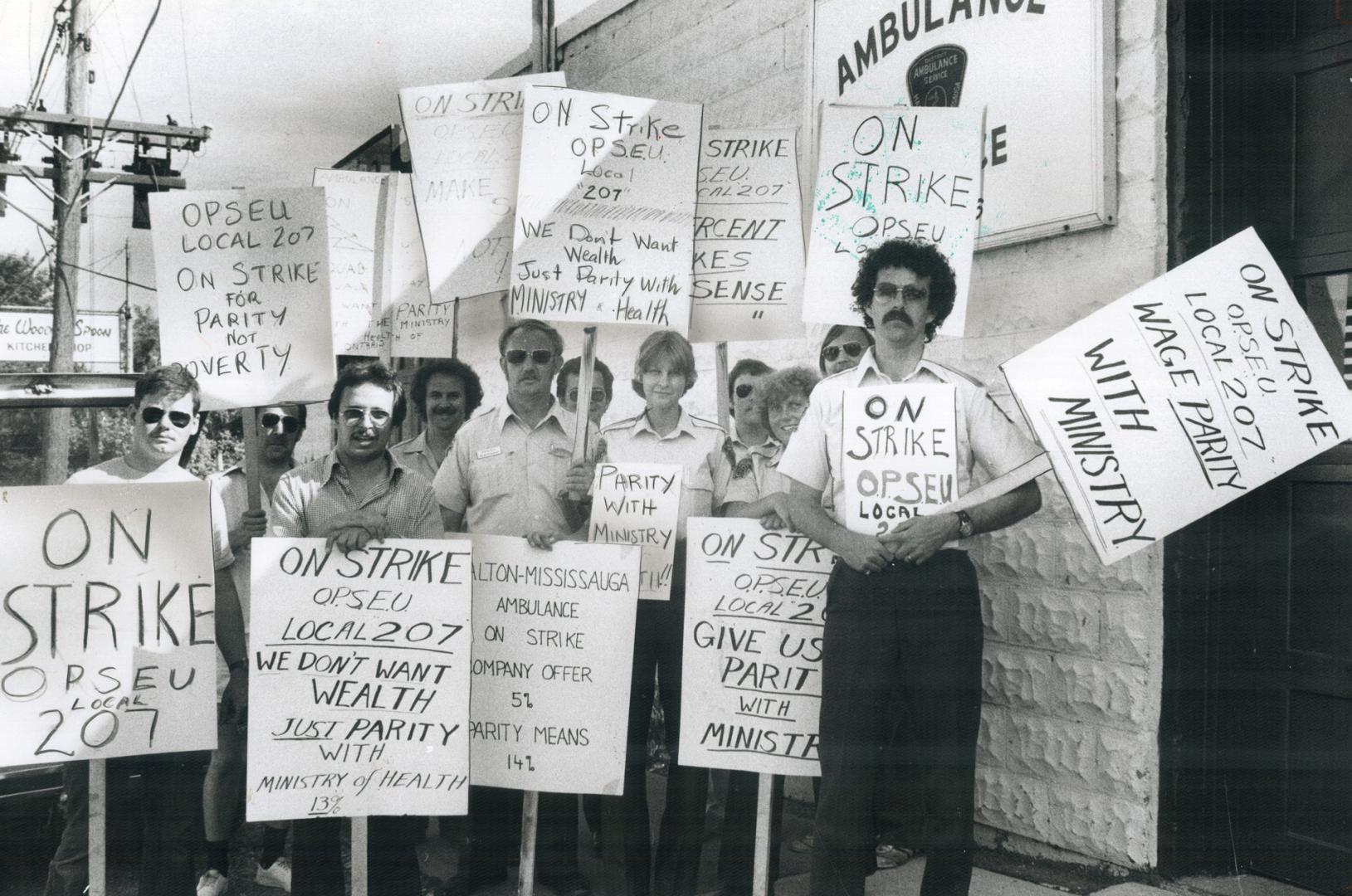 Striking ambulance drivers and attendants set up picket line at Ambulance Station 16 at Dundas St