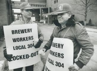 On the outside: Gilles Ste. Croix, left and Louis Turcotte were on the picket line today at Molson Ontario Breweries Ltd. on Fleet St. Ontario's big t(...)