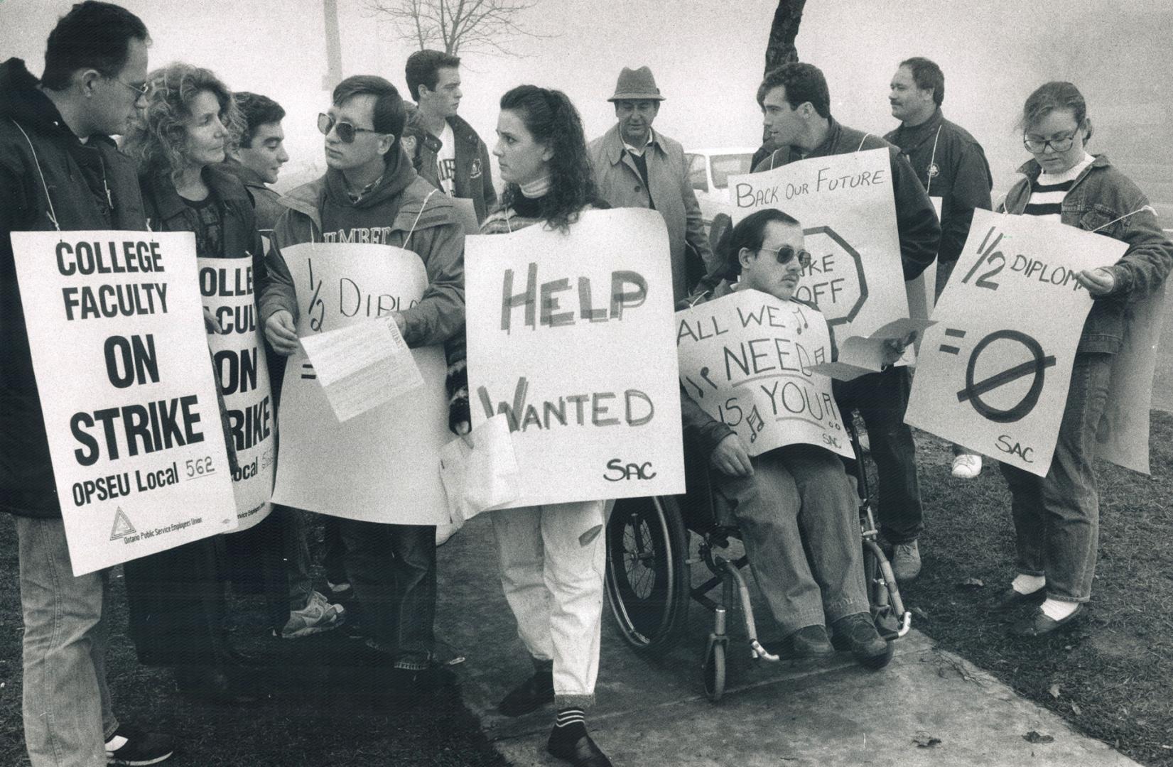 Back to class: Humber College students march alongside their teachers to protest the faculty walkout and pressure both sides to go back to the table and settle the dispute