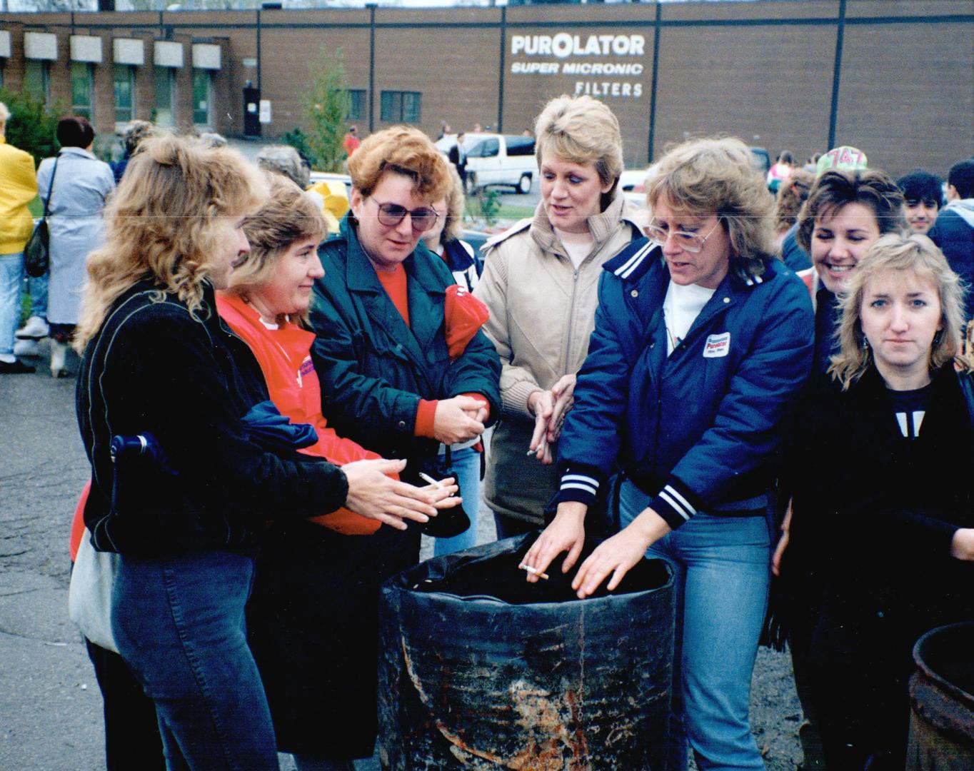 Strikers told jobs wiped out, Strikers at the Purolator Products plant in Mississauga huddle around a fire today discussing the company's bombshell no(...)