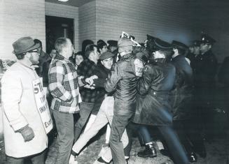 Black door scuffle outside the struck Peterborough Examiner takes place between pickets and police as the officers make an unsuccessful attempt to get(...)