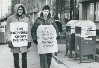 Striking postal worker Paul McDonald, right joins teacher William Seymour on picket line