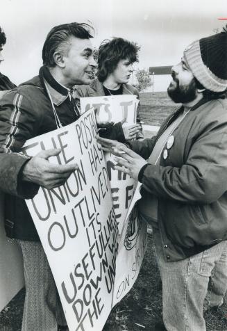 Bob Choma (left) argues with a postal worker