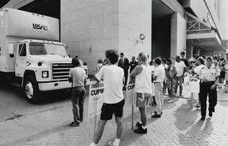 Trucks Blocked: Postal pickets block the lane from the Toronto Island ferry docks yesterday, obstructing trucks carrying mail