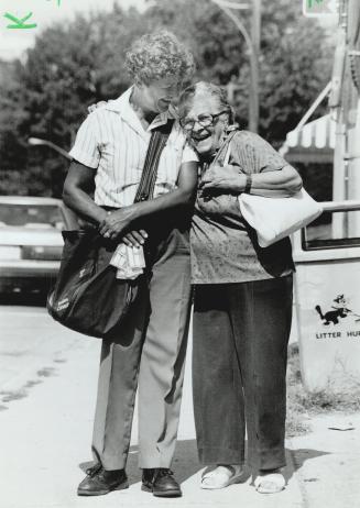 Red letter day: Mississauga resident Elizabeth Roberge, 83, hugs letter carrier Judy McIntyre as she receives her pension cheque yesterday