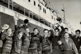 Released from the Welland County jail after being arrested in connection the shipping strike, these seamen are back at Thorold where the C.S.L. liner (...)