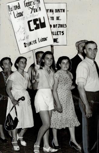 Pickets carried signs and placards, listened to speeches in park at the canal