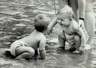 Water babies, These diapered tots have just met at the Sunnyside wading pool and, obviously, appeared unperturbed by yesterday's heat and humidity. Me(...)