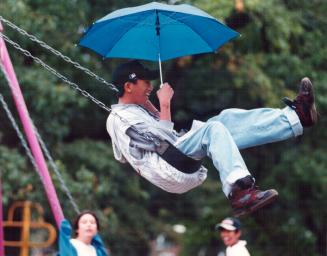 Reggie Clave on Swings at High Park