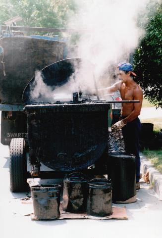 Joey Canto with tar pot in heat wave