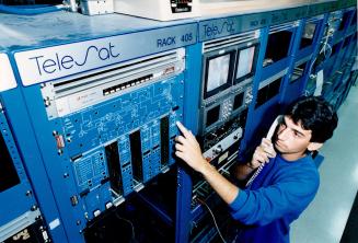 Nerve centre: Marco Larivera monitors the control panel of the Anik C3 satellite at Telesat Canada's new $ 5 million teleport at the foot of Leslie St