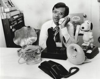 Telephone garden: Mohan Samtani of World of Communications displays several weird and wonderful telephones including the Adam and Eve model