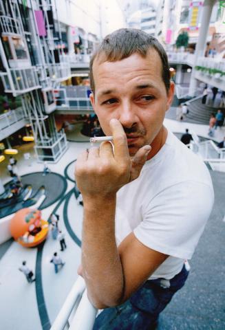 'It sucks:' Danny Grouix of Stouffville draws on a cigarette yesterday at the Eaton centre and condemns tough new rules to restrict smoking there