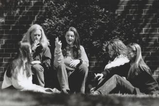 Hanging out: Smoking is part of meeting friends for, left to right, Laura Richardson, Michelle McKenna, Maeve O'Brien, Amy Slotek and Faye Stephensen