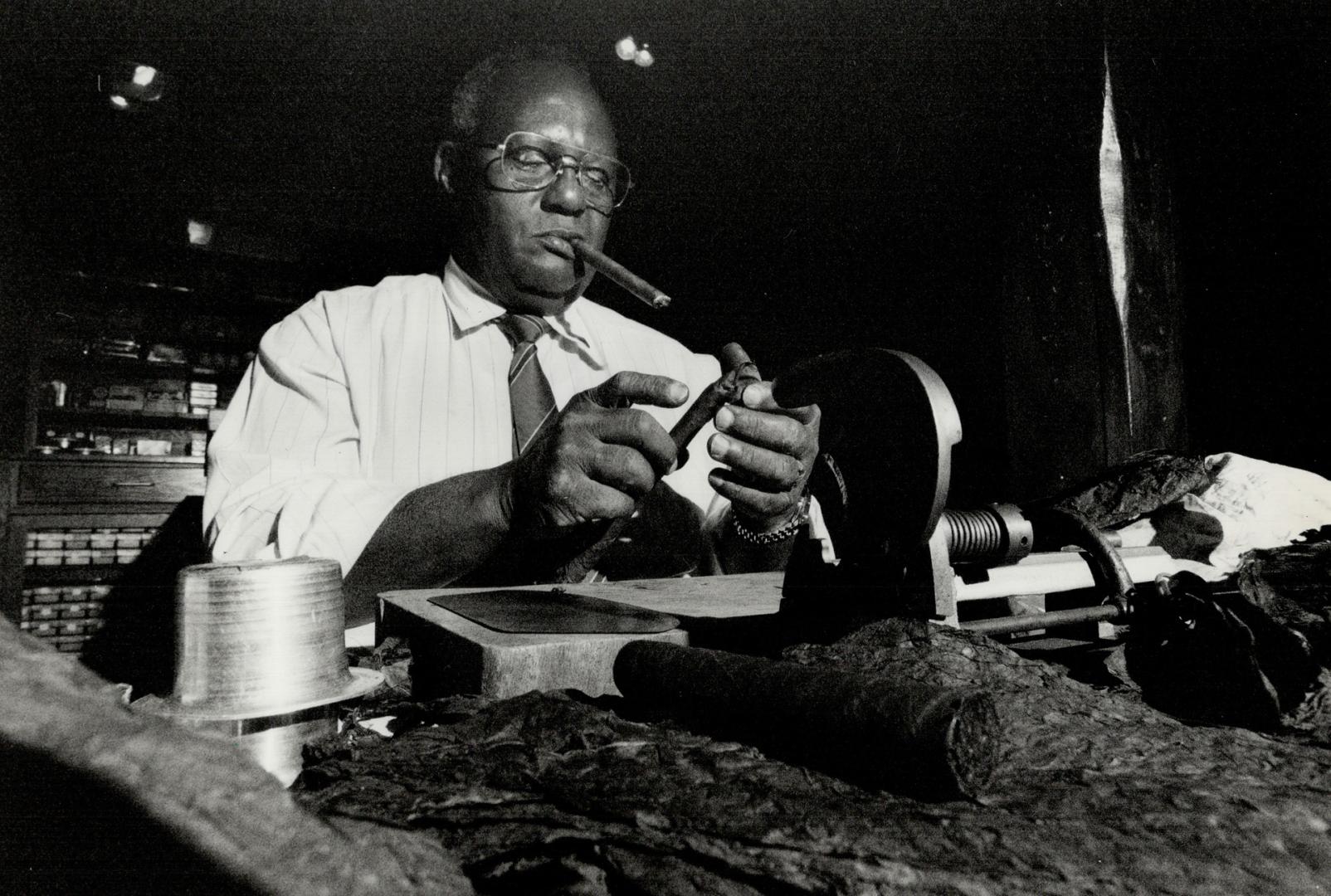 Fifty-three-year-old Agustin Hernandez Diaz, a master cigar roller from Cuba's Partagas factory, shows his artistry at the Havana House on Yorkville Ave