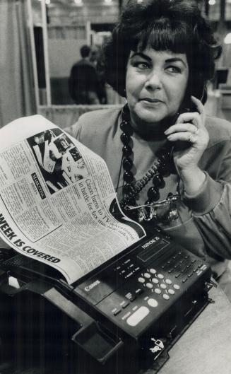 Calling all computerists! Theresa Woffenden of The Office Equipment Specialist tests a Canon Faxphone as she gets ready for the Toronto Business Compu(...)