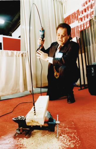 Winning Wares, Mark Wallach demonstrates a 147-centimetre (54-inch) Canadian Flexi Drill bit used for electrical, telephone and alarm installation at The Collseum yesterday