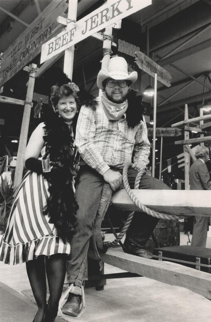 Wild west: Bedecked in western-style duds, Tamara Wellmann and Dan Quandt bring a touch of Lincoln, Nebraska, to the Old West Trail Country booth