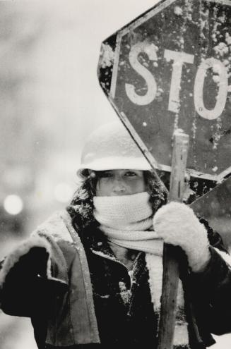 Stop snow, stop!, It's a good thing construction flagman Valerie Butcher of Missisauga bundled up for the job on a recent cold and snowy day