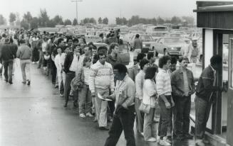 Job-hunters: Men and women lined up by the thousand at Canada's Wonderland this morning to get application forms for 3,000 jobs at a new American Motors plant in Brampton