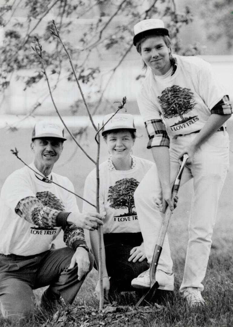 Tree lovers: Under the direction of teacher Robert Nagle, Melissa Smith, 18, and Robert Kidd, 18, plant seedling as part of the Trees for Today and Tomorrow program