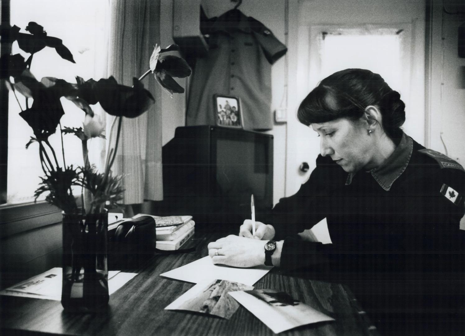 Sgt. Helen Martin, Niagara Faus, Ont, writing letter home. She is working as medical assistant and Pharmacevtist at Golan Heights Camp in Israel