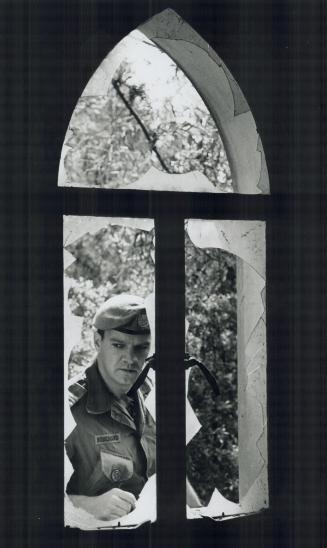 Maj. Yvan Bouchard, from Anse - St. Jean, P.Q. Checking what use to be one time French embassy located now in no man land at Nicosia, Cypress