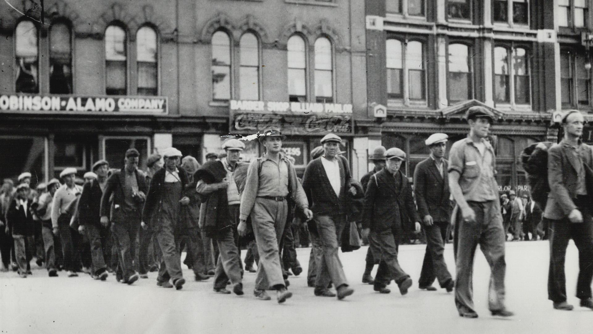 Camp strikers is seen at RIGHT lining up for their match on the city hall square, when They are seen at the LEFT as they marched through the streets of the city