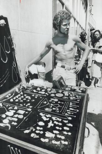 Street vendor Ralph Levitin, above, sells handicrafts at stand on Yonge St