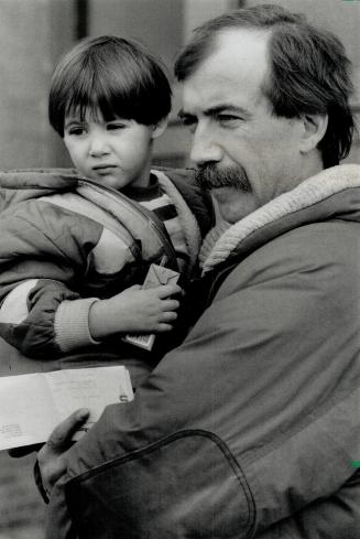 Final look: Craig McDowell, with daughter Nicole,3, takes a last look at Southam Murray printing plant which closed last week