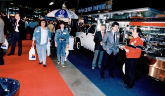 $34,800 coffee wagon: That's the price of this catering truck, which Frank Gruskovnjak (brown jacket) and Paul Antolin (hands in pockets) display at HostEx 88